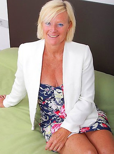 Naughty blonde housewife playing on the bed