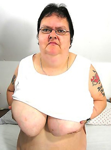 Big mama playing with her toy and tits