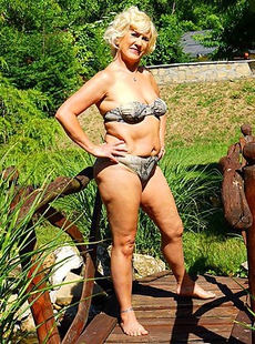 Horny blonde mature woman getting naughty in her garden