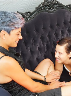 Old and young lesbian couple make out on the couch