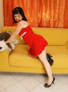 This horny housewife shows off on her couch