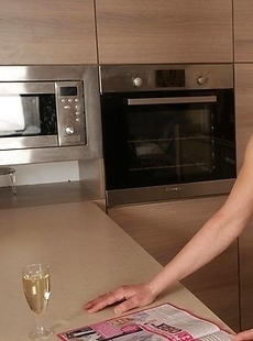 Blonde housewife gets frisky in the kitchen