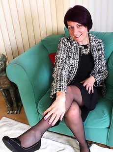 Naughty housewife stripping and teasing