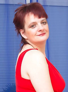 Horny housewife teasing on the bed