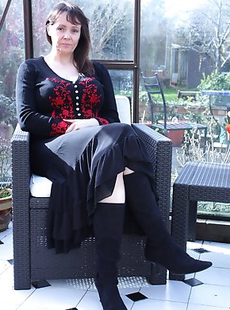 Big breasted British housewife getting wet